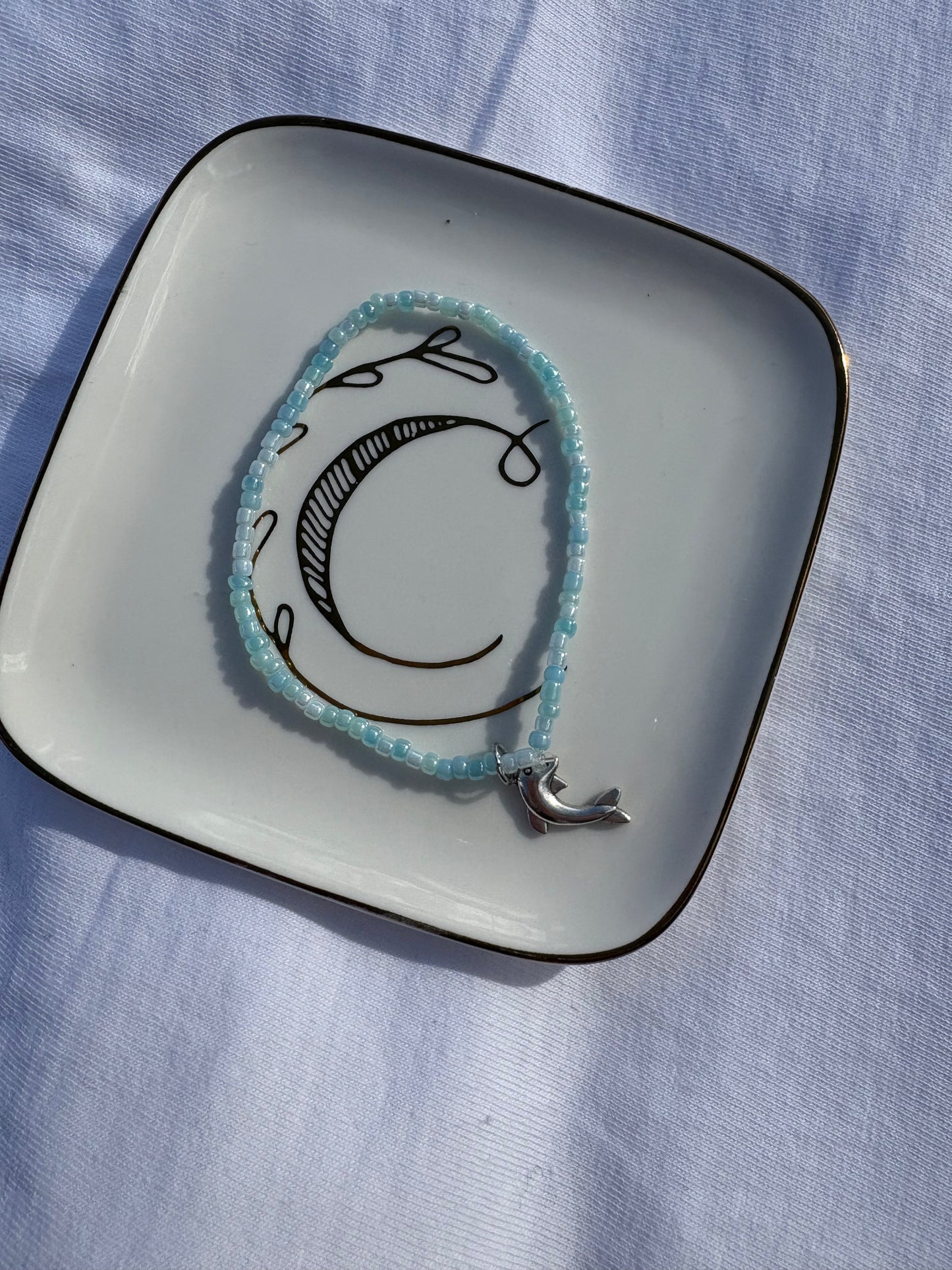 Seed bead dolphin charm bracelet