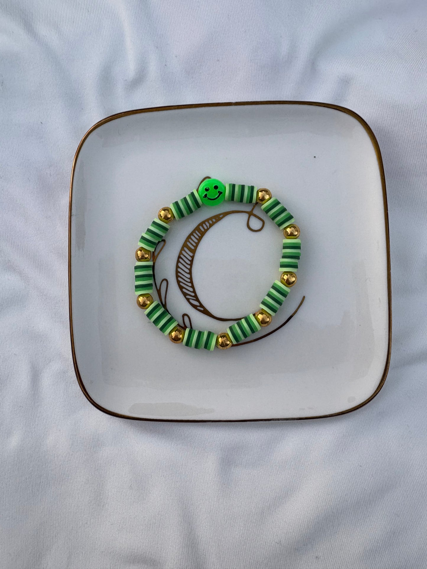 Green smiley face bracelet