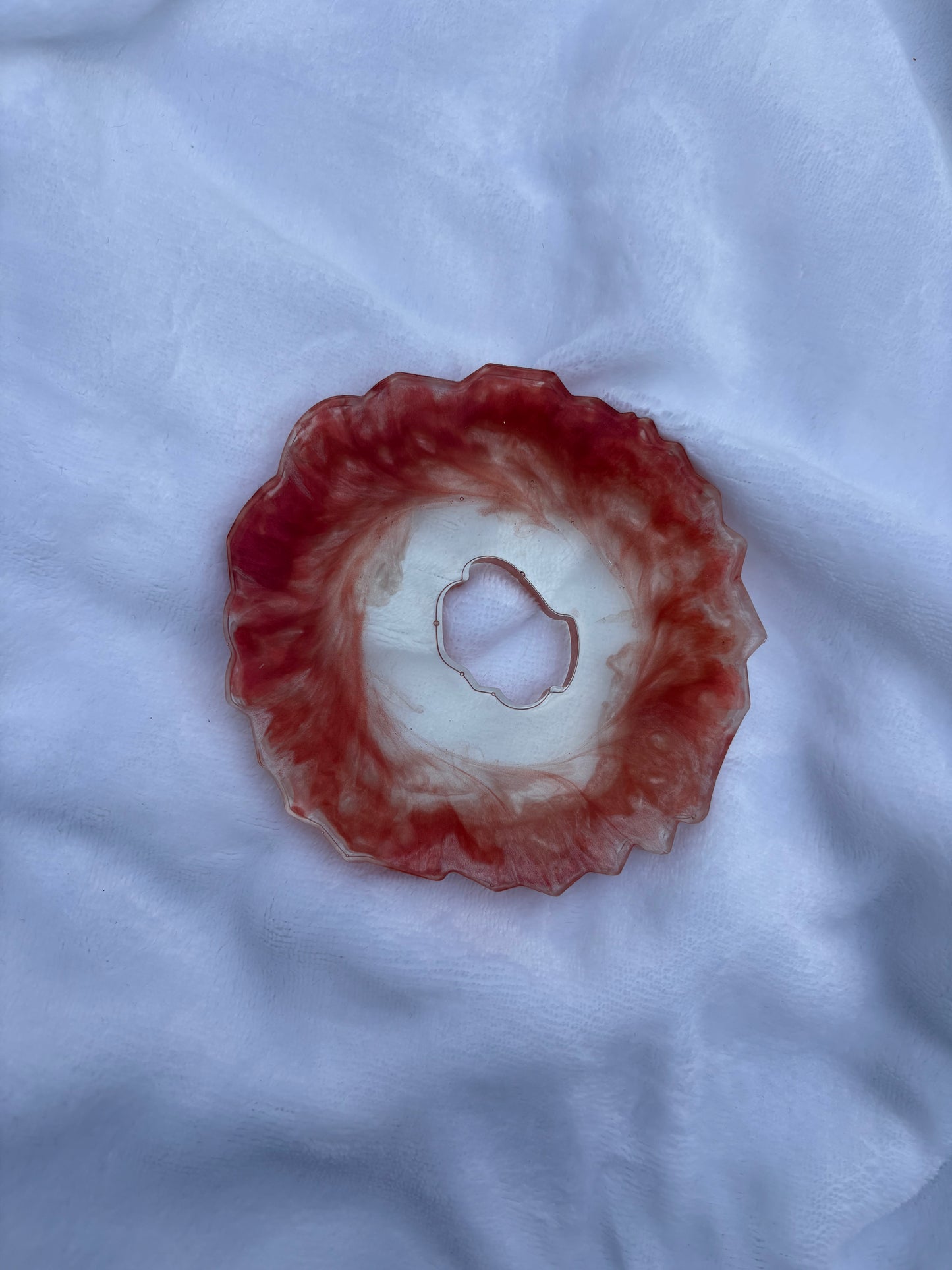 Red and silver resin coaster