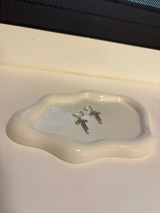 Silver huggie hoop bow earrings